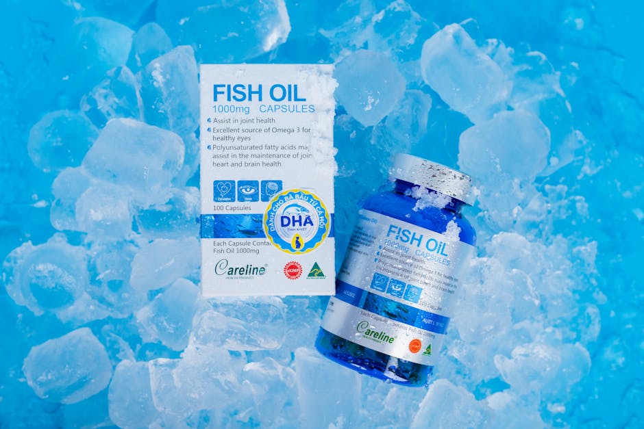 Fish oil capsules and packaging on ice, highlighting Omega 3 benefits for health.